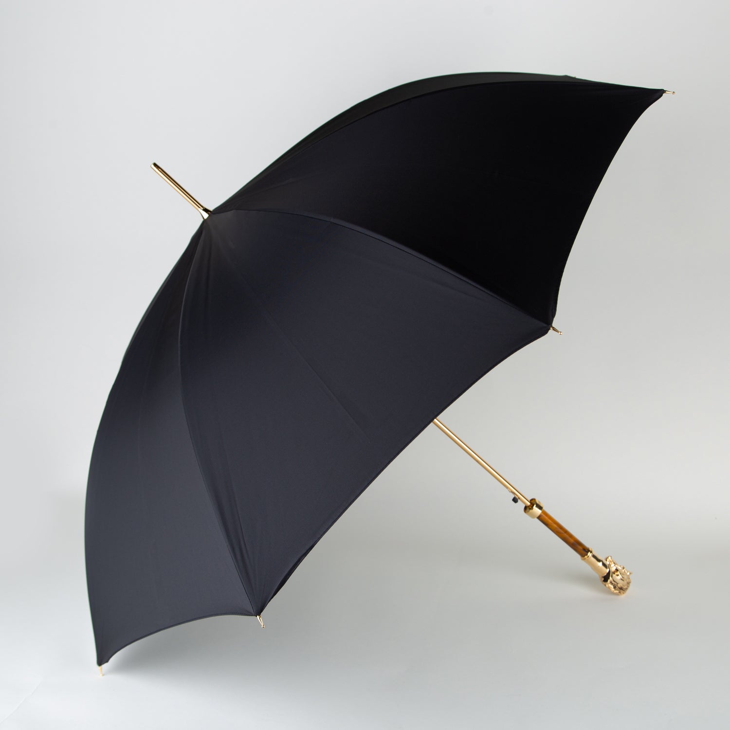 golden horse umbrella with a black canopy