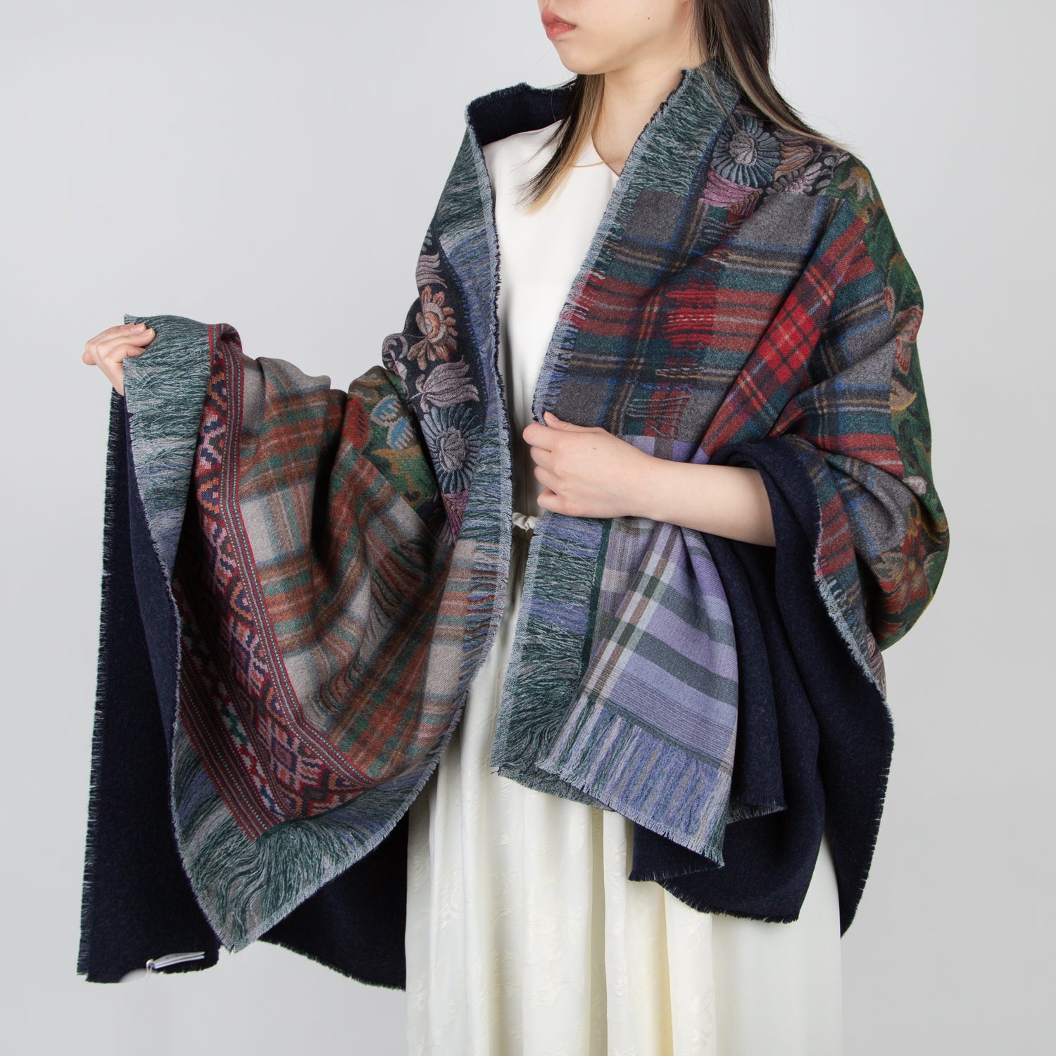 girl wearing a pierre louis mascia multi colored floral plaid and geometric print wool blanket
