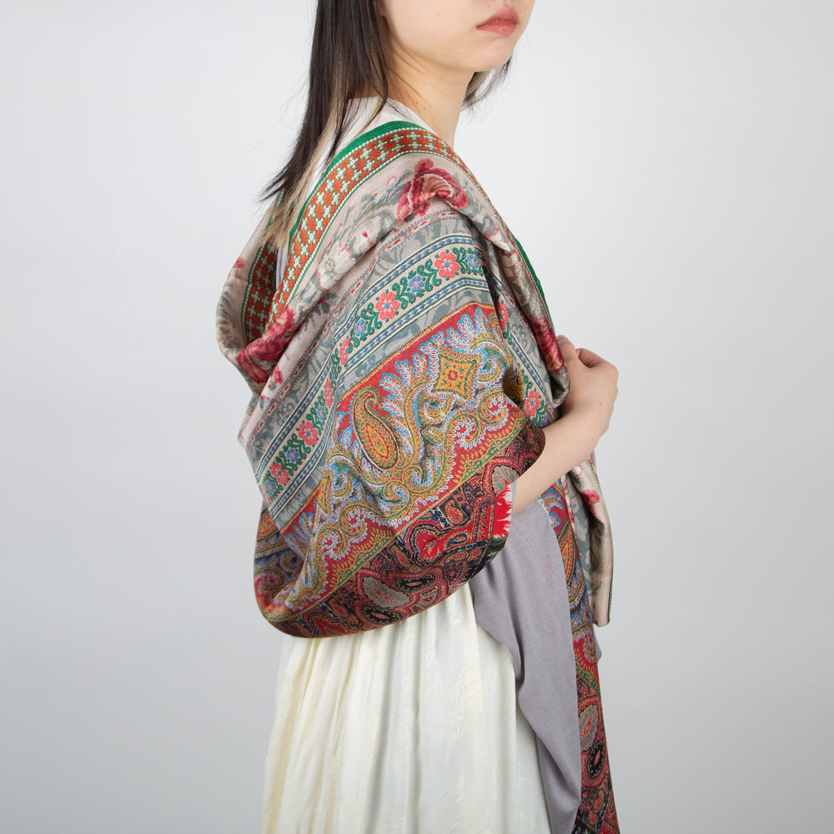 girl wearing a pierre louis mascia multi-colored floral and paisley wool blanket