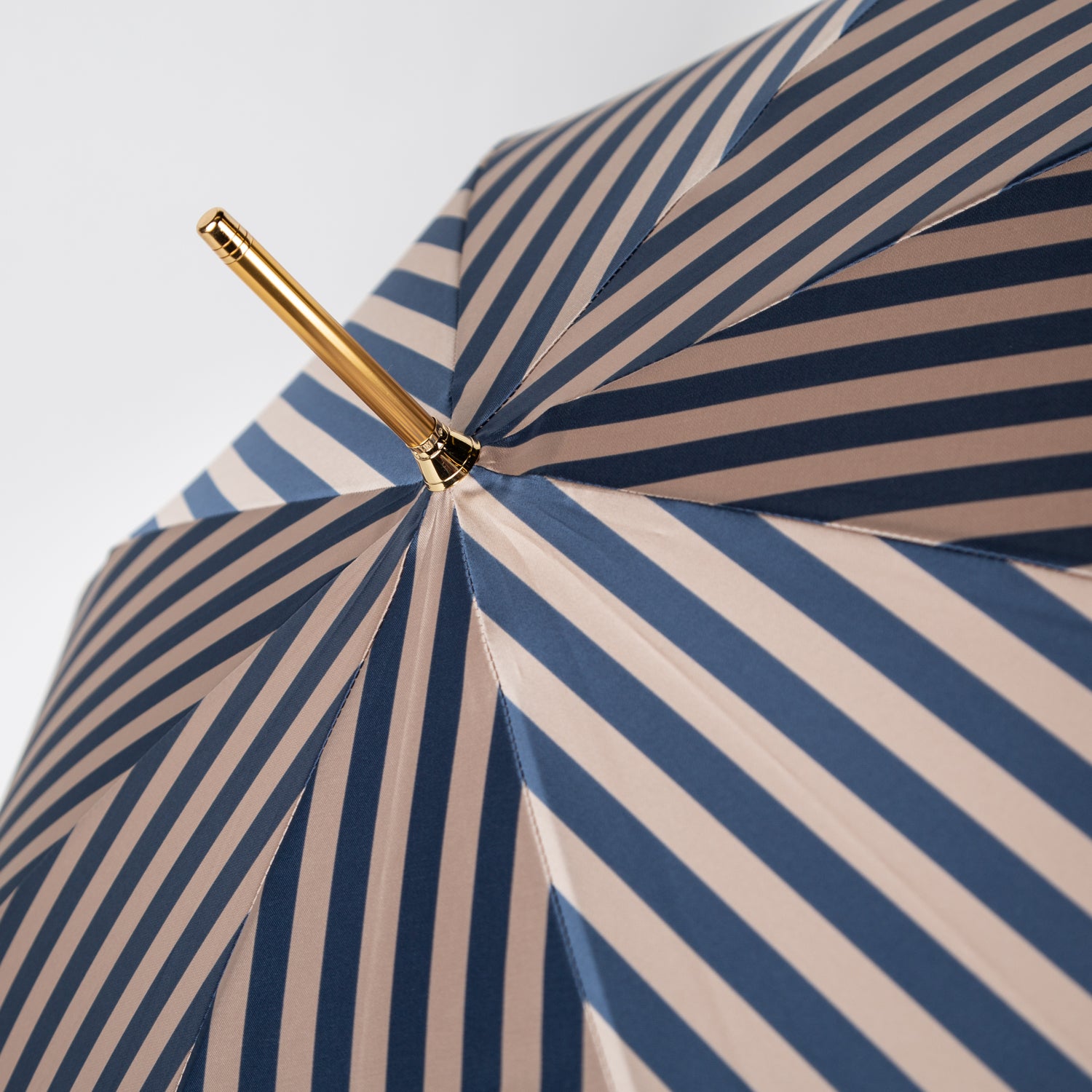 striped blue umbrella with malacca wood handle