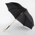 black umbrella with golden skull knuckleduster handle