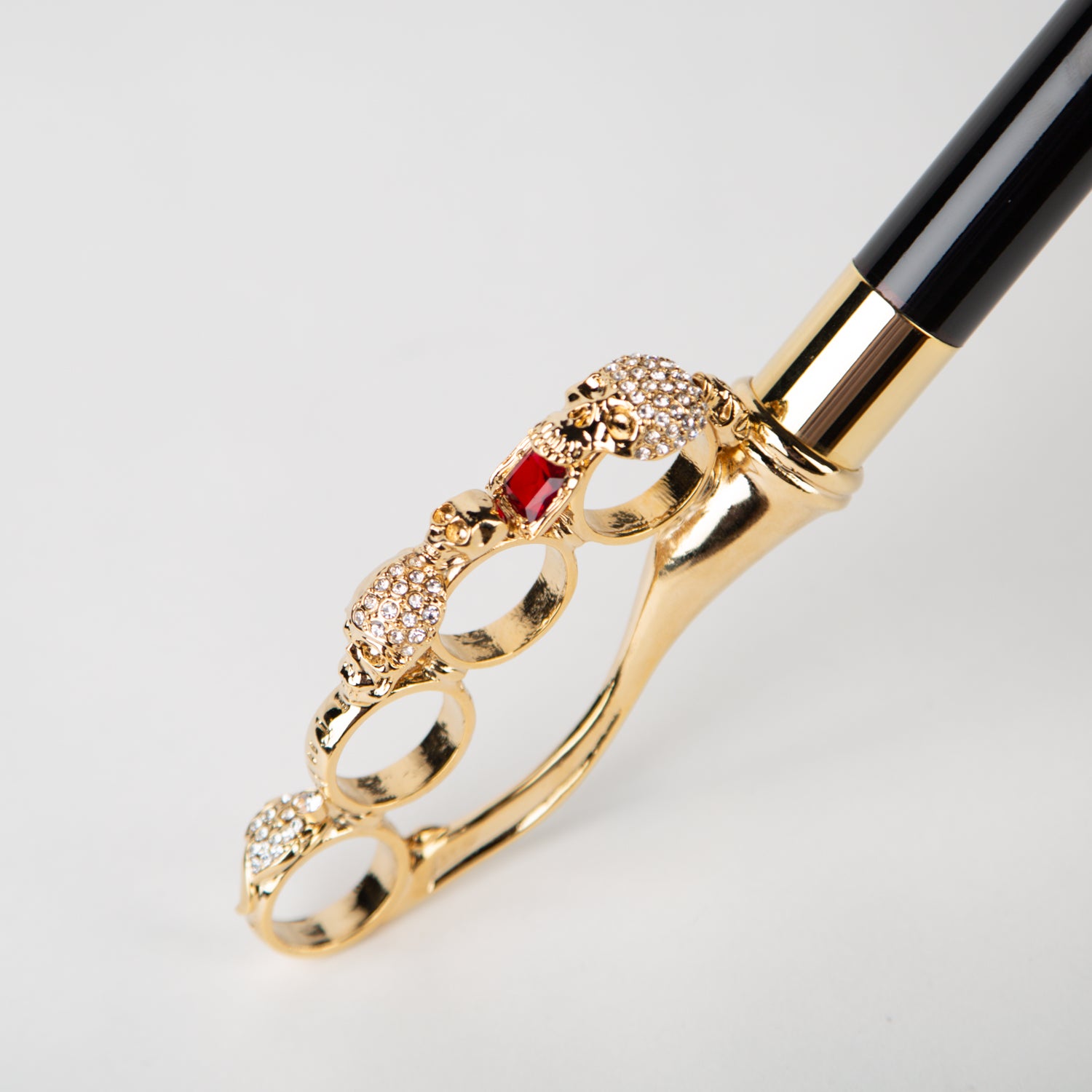 black umbrella with golden skull knuckleduster handle